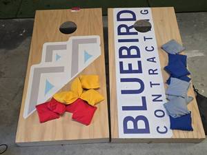 lot 21918 image: Two Wood Cornhole Boards with Custom Printed Graphics and Bean Bags