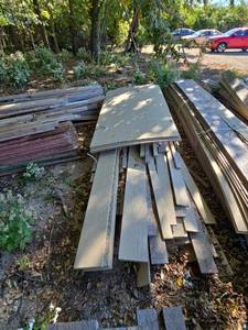 lot 21923 image: Lot of Assorted Textured Wood Siding Panels, Planks and Dimensional Lumber