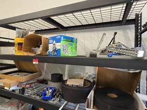 lot 21935 image: Lot of Wallbase Rolls, Door Closers, Locksets, Shelf Brackets &amp Shop Towels  Shelving Not Included