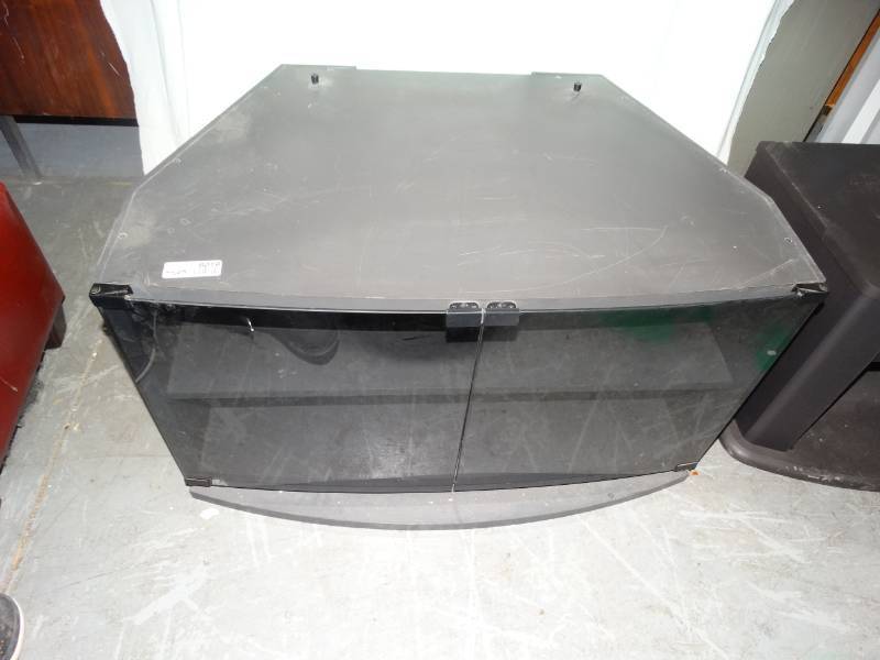 lot 8019 image: black tv stand with glass front doors -- approx L35xW22 12xH20