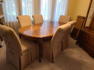 lot 800 image: Dining Table 29x 82x 43 includes 1 18 inch leaf in table as pictured  and additional 18 inch leaf, tables pads for all,  6  Upholstered  Skirted Parsons Style Dining Chairs featuring rolled top back and vertical back loopbutton details