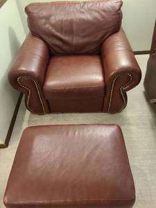 lot 802 image: Brown club armchair with nail head trim, 35x42x36, floor to seat 19, and ottoman, 16x27x20