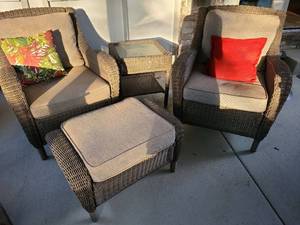 lot 808 image: Two porch wicker chairs, 36x28x38, floor to seat 18in., ottoman, 16x39x20, side table, 22x20x20, with removable cushions and throw pillows