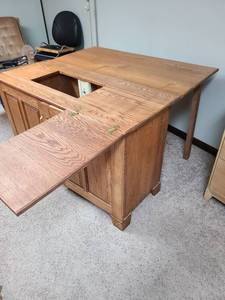 lot 821 image: Sewing cabinet, 30x48x20.5, with doors and drawers, fold out top, comes with attached power strip, very nice, heavy and located in basement