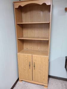 lot 824 image: Wood Cabinet Bookcase with Two Doors 3 Shelves, 72x28x13, located in basement