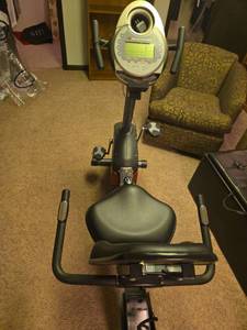 lot 830 image: Schwinn Stationary Exercise Bike with LCD Display, located in basement