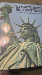 lot 908 image: United States liberty stamp album not all stamps pictures pages are not fully filled out