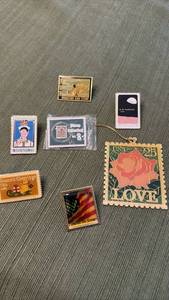 lot 923 image: Lot of 8 Collectible Stamp Pins and ornament
