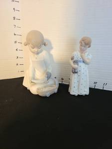 lot 1006 image: NAO by LladroZaphir in Spain young woman with baby, and vintage Royal Copenhagen girl with doll no. 3539