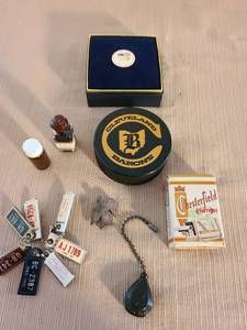 lot 1044 image: Vintage Chesterfield Cigarettes Metal Slide Ashtray in box, miniature license plates, Cleveland Barons hockey puck, We The People pin, more