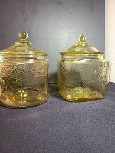 lot 1059 image: Two amber depression glass covered cookie jars