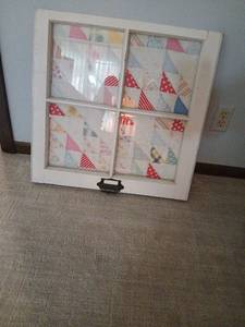 lot 1082 image: Hand sewn Quilt Square displayed in old double le hung window 24x24
