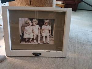 lot 1083 image: Old double hung window with tinted photography  titled The Kiss by Furman S. Baldwin22.5 x 28.5