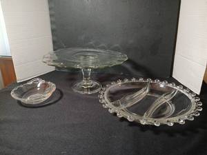 lot 1095 image: Glass Tableware Lot Pedestal  cake Stand, small shallow bowl, and  Divided Bowl