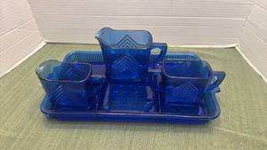 lot 1106 image: Vintage Hazel Atlas cobalt blue glass sugar and creamer with pitcher in Chevron pattern with divided tray