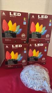 lot 1213 image: Enchanted Forest LED 70 C9 Light Set Lot of 4 Boxes and clips to be on house