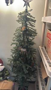 lot 1214 image: Prelit 5 foot Christmas tree with ornaments on it