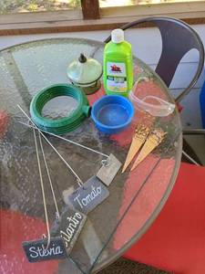 lot 1302 image: Tiki Clean Burner and  Fuel with Garden Accessories Lot