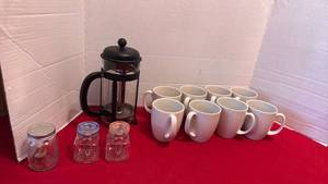 lot 1402 image: 8 Corelle stoneware coffee mugs, French press and small jars