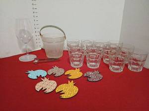 lot 1438 image: Glassware Lot 1 plastuc Wine Glasswith coaster, 1 Ice Bucketwith Tongs, 12  Glasses,  5 Pineapple Coasters