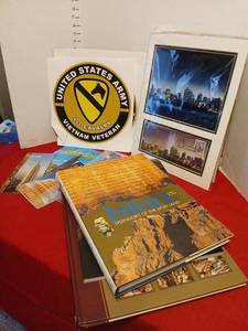 lot 1612 image: United States Army 1st Cavalry Vietnam Veteran Memorabilia  stickers, 911 photo 12x16, New York Travel guides, and more