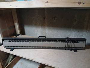 lot 2108 image: Baseboard Convection Heater 120V Electric 49inches long  untested located in basement