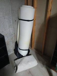 lot 2111 image: Rolled Foam Pad 1inches thick and canvas tarp located in basement