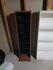 lot 2112 image: Media rack adjustable  shelves 46x11x6 located in basement