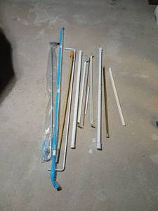 lot 2114 image: Curtain Rod Set  Multiple Sizes located in basement