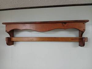 lot 2208 image: Wall Shelf with quilt bar 22x10x5 located in basement