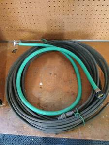 lot 3001 image: Soaker hose with garden hose