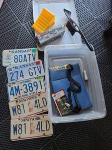 lot 3208 image: Tote with license plates abd automotive supplies