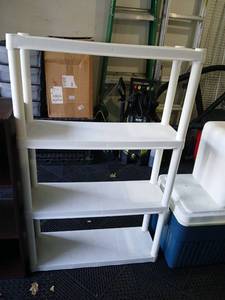 lot 3403 image: White  plastic shelving  Unit  47x30x10 located in garage