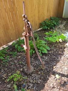 lot 4104 image: Hand Operated Water Pump with Lever Handle and Side Spout 52 inches in backyard