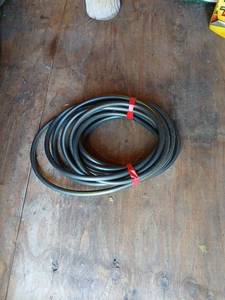 lot 5008 image: Black garden hose