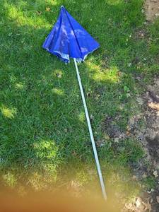 lot 5027 image: Small blue patio umbrella, no base