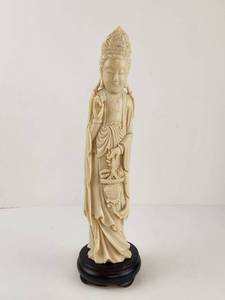 lot 120 image: Carved Ivory Colored Figurine on Black Wooden Base&nbsp
