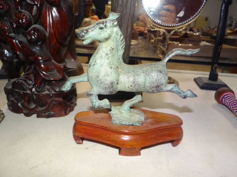 lot 8830 image: Small bronzecast metal horse on wood stand