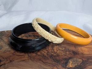 lot 3607 image: Vintage Bangles Lot of 3 Black, Yellow, and Cream Carved (floral design)