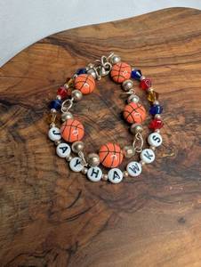lot 3613 image: Handmade KU Jayhawks Basketball Beaded Bracelet with Letter Charms