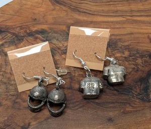 lot 3617 image: 2 Pair Sports Charm Earrings Includes Jersey  Football Helmet&nbsp