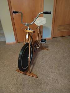 lot 941 image: Schwinn Exerciser Stationary Exercise Bike.  Located in basement