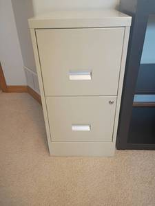 lot 947 image: 2 Drawer Metal Filing Cabinet with Keys.  29 x 15 x 18.  Located in basement