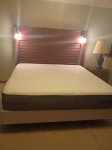 lot 949 image: King Sized Bed with Mattress and Box Springs.  Headboard 67 x 81.   Nice mattress.  Located in basement