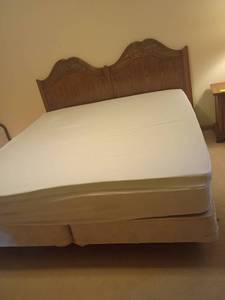 lot 960 image: King Sized Bed with Mattress, Box Springs and Mattress Topper .  Headboard 47 x  80.   Located in basement