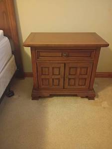 lot 962 image: Town and Country Elegant Furniture and Interiors Co. Wooden Side Table with Bible in drawer.   24 x 27 x 16.  Located in basement
