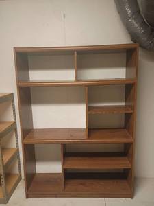 lot 973 image: Entertainment Center used for Storage in the basement. 68 x 50 x 16.  Located in basement