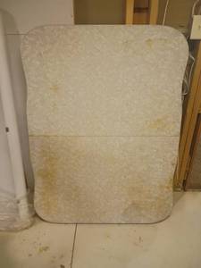 lot 977 image: Vintage Formica Top Kitchen Table.  Legs need attached.  48 x 35 x 3.   Located in basement