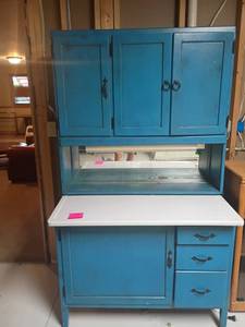 lot 980 image: Vintage Hoosier Style Kitchen Cabinet.  Painted Blue. Looks like two pieces.  70 x 40 x 25.  Located in basement