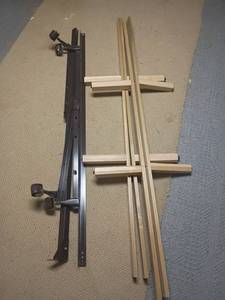 lot 984 image: 2 Bed Frames.  Metal 2 pieces and Wooden 4 pieces.  Located in basement